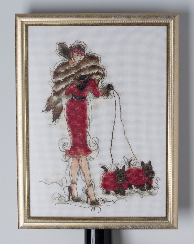 Lady with Scotch Terriers cross-stiched framed in red and brown colours
