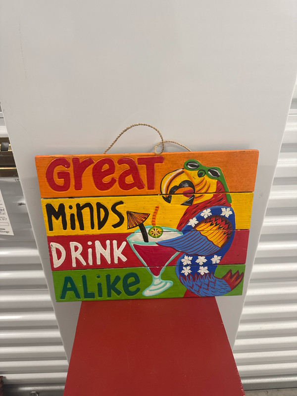 Colorful parrot hanging tiki bar sign