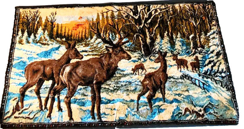 Vintage crushed velvet tapestry of forest winter scene with deer family.