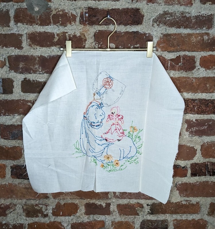 Vintage Homemade Hand Embroidered Girl in a Hat Playing with a Doll gallery